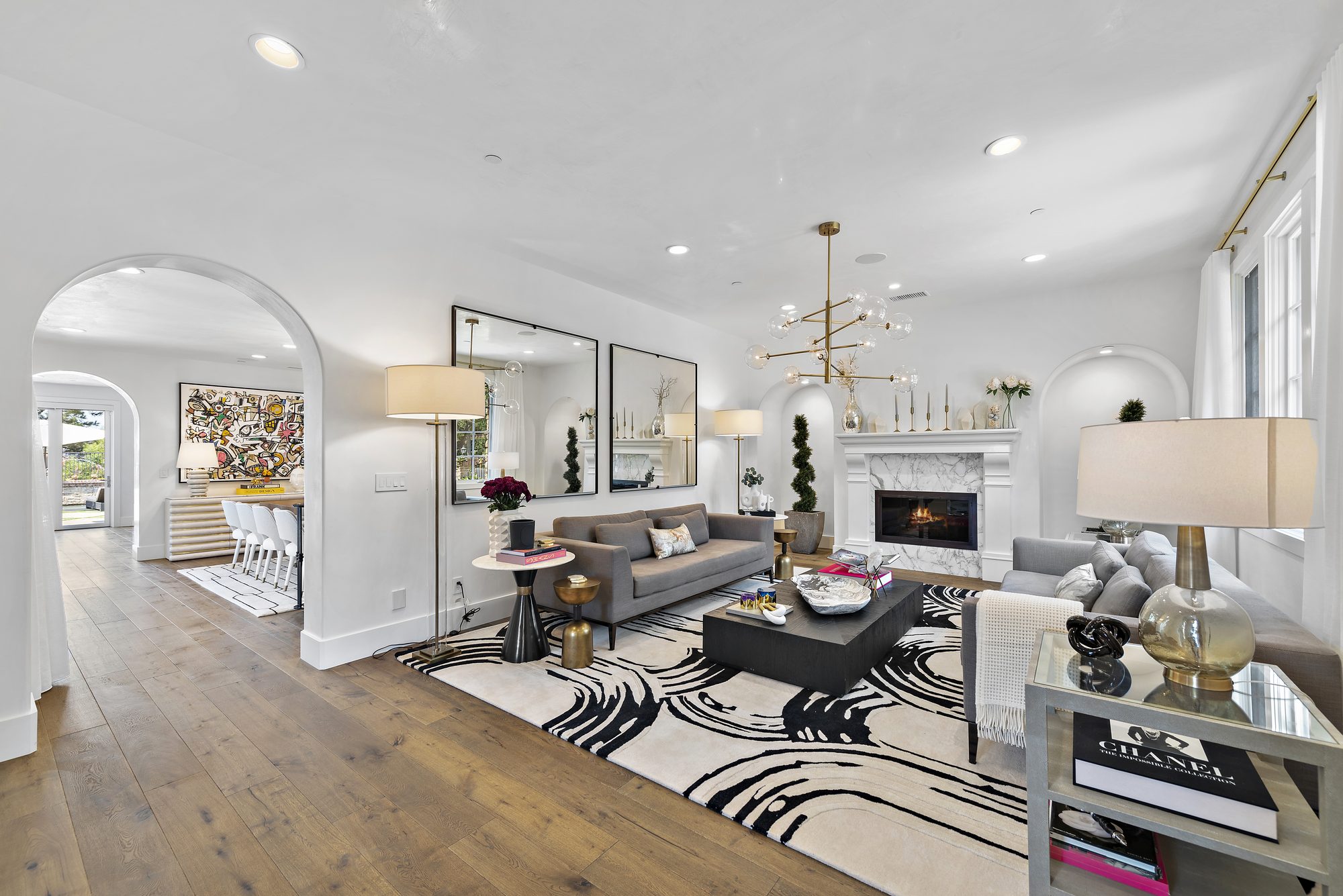 Living room designed by Ariane Bibas, with the fireplace between two arched niches
