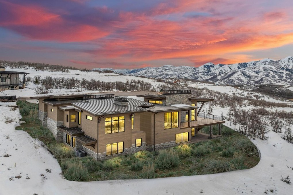 Park City Residence — mountain home at sunset above snow-covered hills